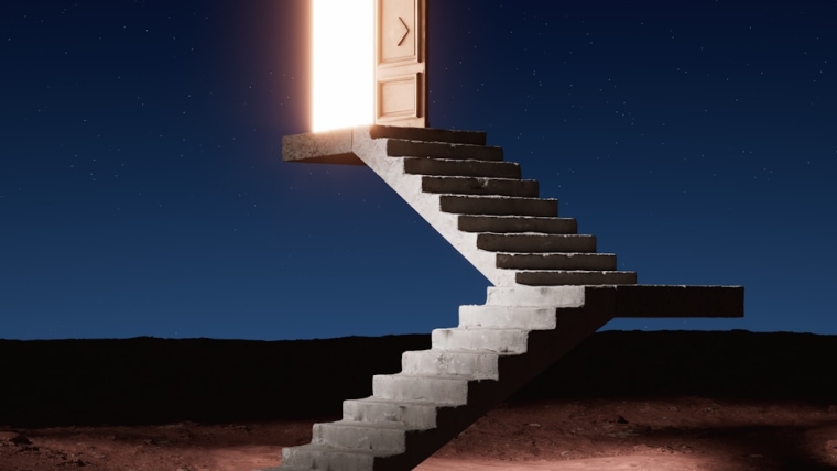 a staircase leading to an open door in the desert